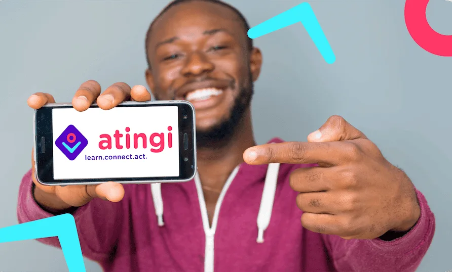 atingi campaign: a learner holding up the atingi app